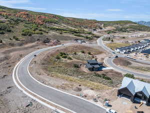 Birds eye view of property with a mountain view