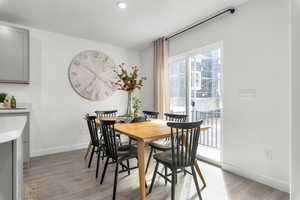 Dining room with light hardwood / wood-style floors