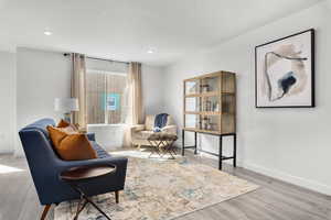 Sitting room featuring light hardwood / wood-style flooring