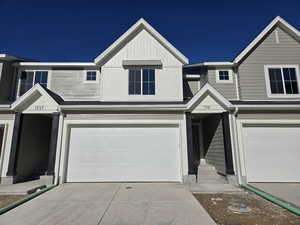 View of front of property with a garage