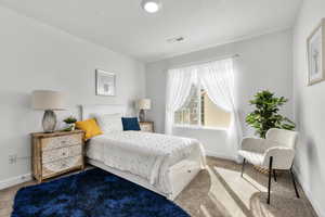 View of carpeted bedroom