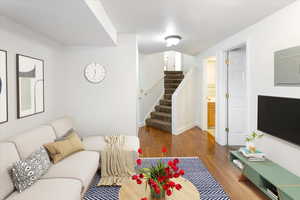 Living room with wood-type flooring