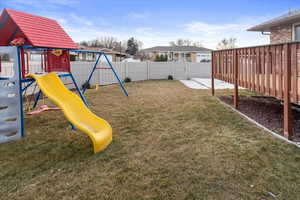 View of playground featuring a yard