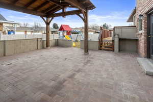 View of patio / terrace with a gazebo and a playground