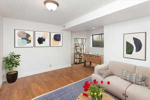 Living room with wood-type flooring