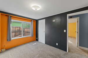 Unfurnished bedroom with a closet, carpet flooring, and a textured ceiling