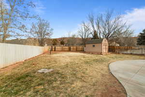 View of yard featuring a storage shed