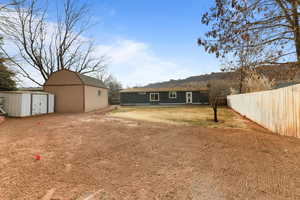 View of yard featuring a shed