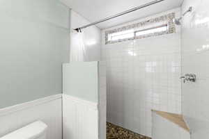 Bathroom with toilet and walk in shower