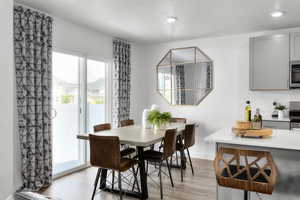 Dining space featuring light hardwood / wood-style floors