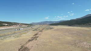 Property view of mountains with a rural view