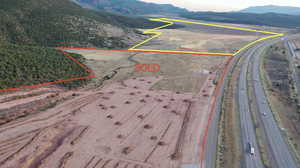 Birds eye view of property with a mountain view