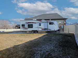 Rear view of property featuring a lawn