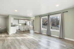 Unfurnished living room with light hardwood / wood-style floors