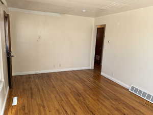 Unfurnished room featuring wood-type flooring