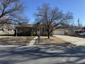 Single story home with an outbuilding and a garage
