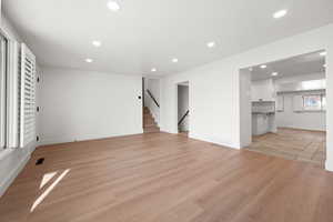 Unfurnished living room with light wood-type flooring