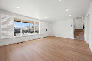 Unfurnished room with light wood-type flooring