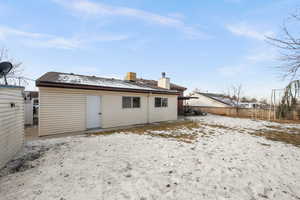 View of snow covered property