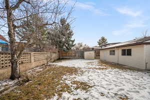 View of yard layered in snow