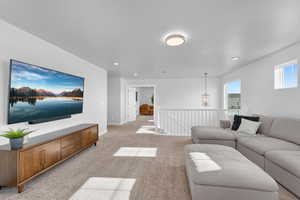 Living room featuring light colored carpet