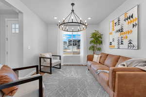 Living room with a wealth of natural light and light hardwood / wood-style floors