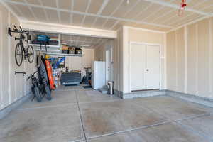 Garage with white fridge