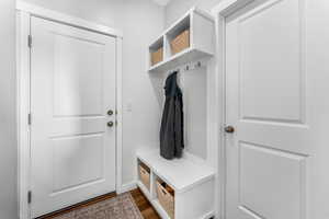 Mudroom with dark hardwood / wood-style flooring