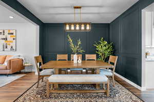 Dining space featuring dark wood-type flooring