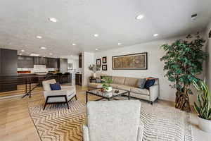 Living room with light hardwood / wood-style flooring