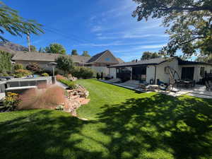 View of yard with a patio and an outdoor hangout area