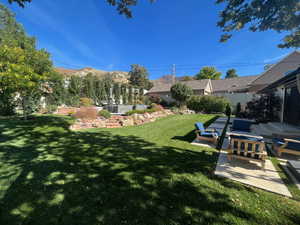 View of yard with a patio