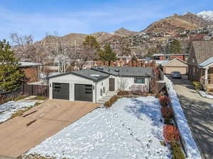 View of front facade with a mountain view and a garage