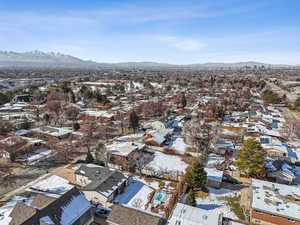 Snowy aerial view featuring a mountain view