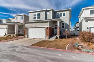 View of front facade featuring a garage