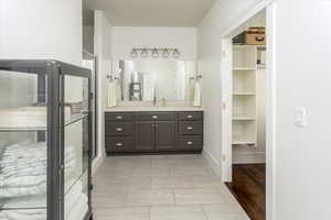 Bathroom with walk in shower and vanity