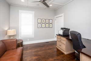 Office with ceiling fan and dark wood flooring