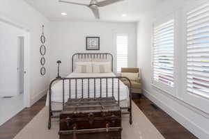 Bedroom featuring ceiling fan and dark hardwood