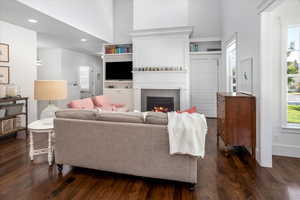 Living room featuring a fireplace and dark hardwood / wood-style flooring