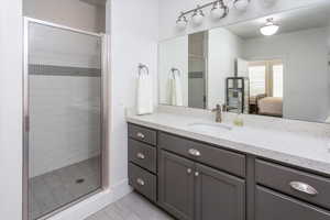 Bathroom with walk in shower and vanity