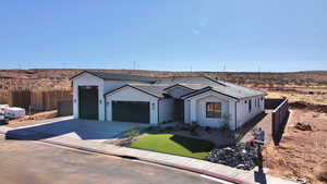 View of front of home featuring a garage