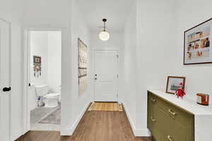 Doorway featuring hardwood / wood-style floors