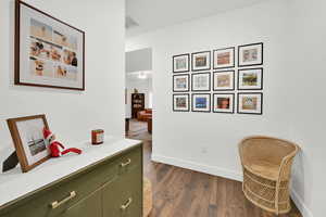 Hall with dark wood-type flooring