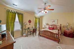 Bedroom with ceiling fan, a textured ceiling, vaulted ceiling, and light carpet