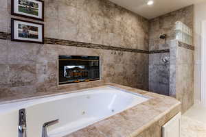 Bathroom featuring plus walk in shower