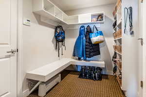 Mudroom featuring carpet