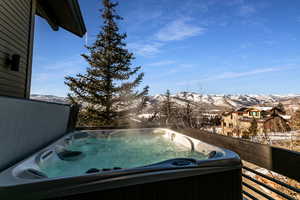 Exterior space with a mountain view and a jacuzzi