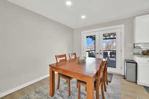 Dining area featuring light hardwood / wood-style floors and french doors