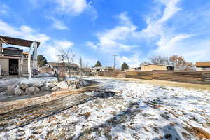 View of yard covered in snow