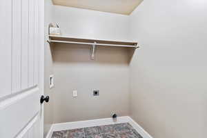 Laundry room featuring hookup for a washing machine and hookup for an electric dryer